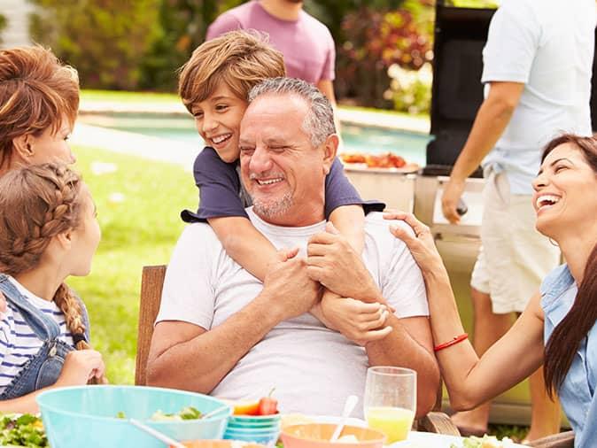 maine family eating outside during the summer