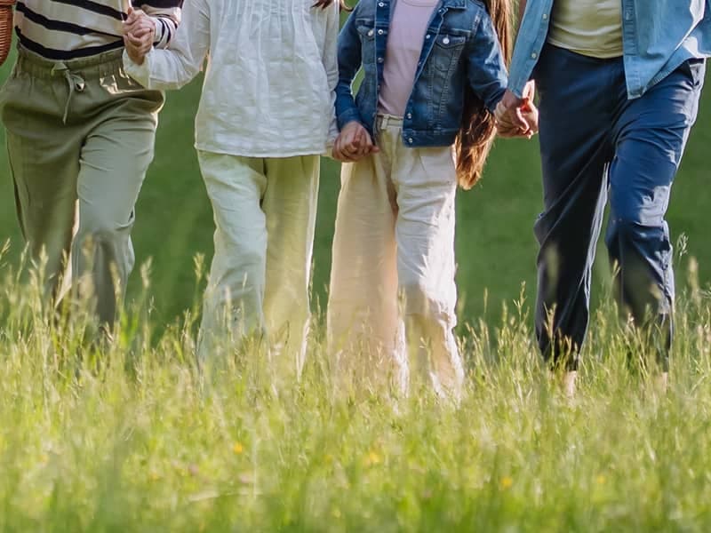family walking through tick infested field in cape elizabeth maine