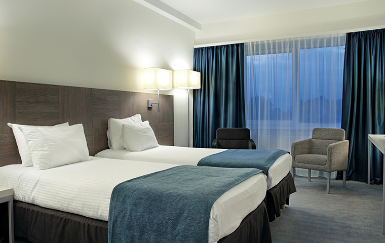 Quality Pest Control For Your Hotel interior of a hotel room with two beds