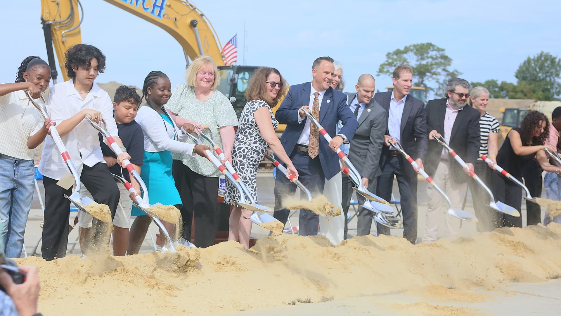 People Shoveling Sand