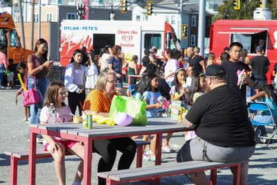 Food trucks and people eating