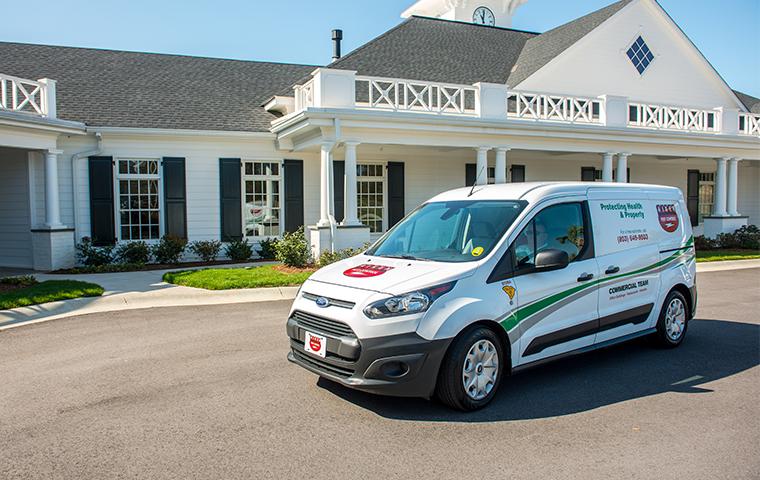 commercial company van in front of business