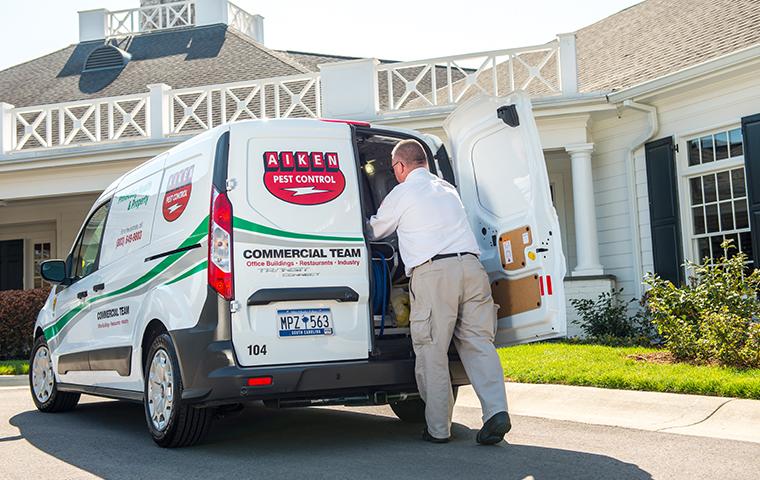 aiken tech getting equipment from a commercial company van