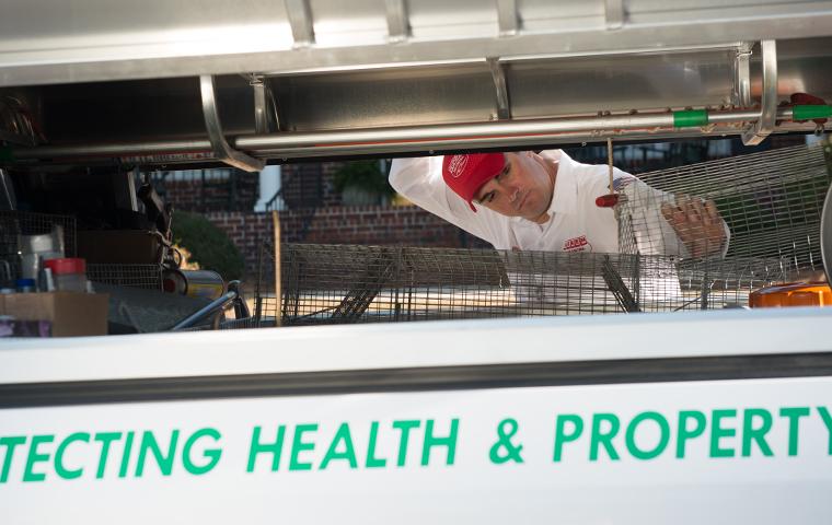 aiken pest tech loading live traps into company truck