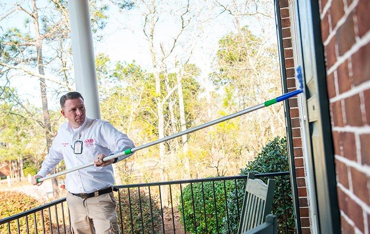 aiken tech treating exterior window on house