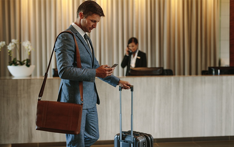 a man standing in a hotel lobby