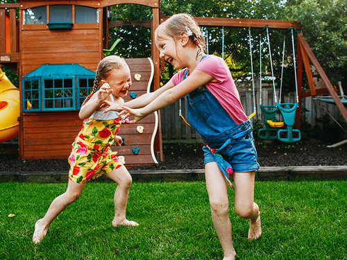 Are Mosquitoes Attracted More To Some People Vs. Others family playing in backyard