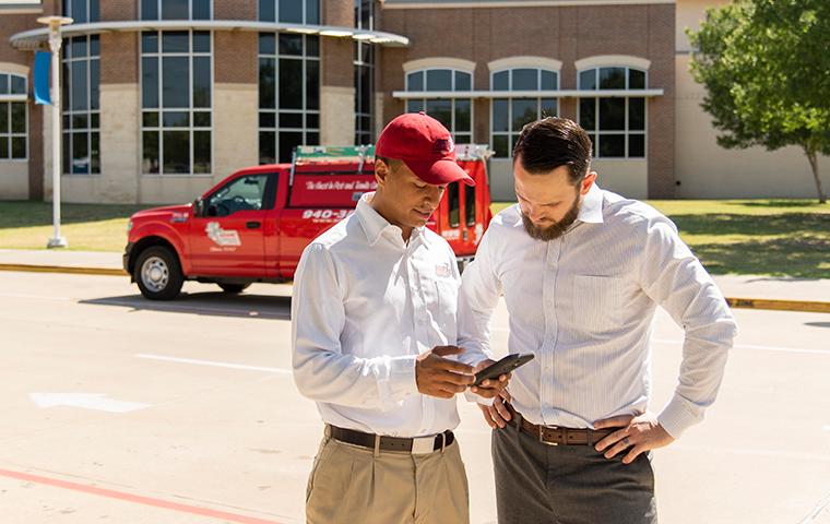 tech discussing service with business client