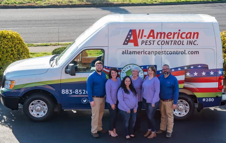 Our Team Gives Their Best Work To You all american team standing in front of their service vehicle