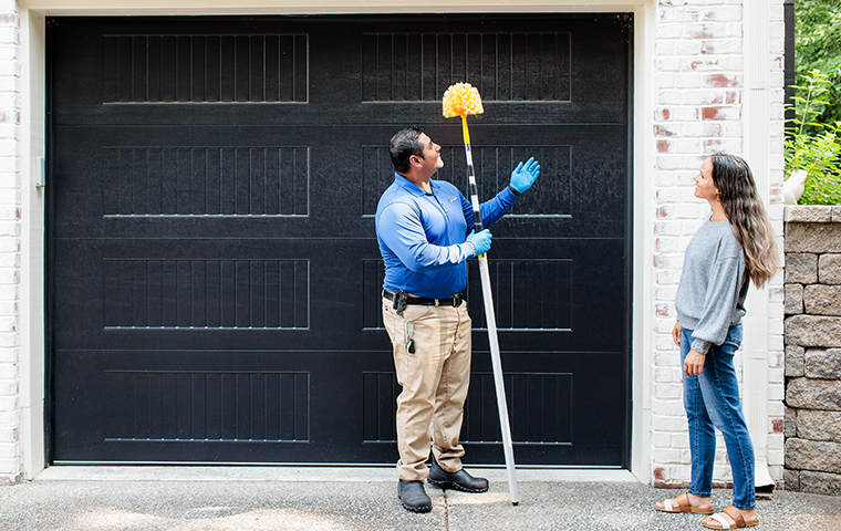 Eco-Friendly, Responsible Pest Control nashville pest control technician performing cobweb removal