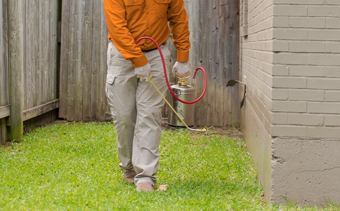 Our Treatments Are Thorough And Guaranteed technician treating home in fayetteville georgia
