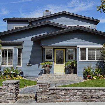 blue house with a yellow door